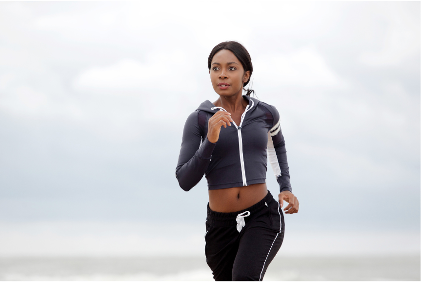 A picture of a woman running outdoors.