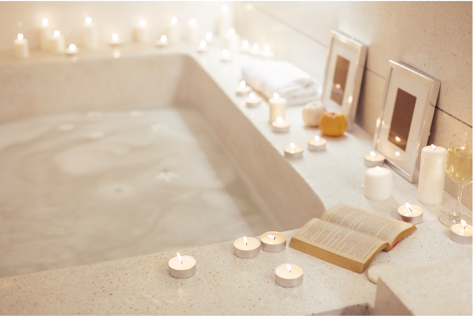 A relaxing bathtub with lit candles showing "luxury unwind time" to help deal with stress at work.