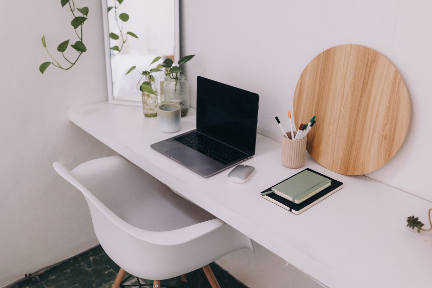 Picture of laptop on a minimalist, clean desk.