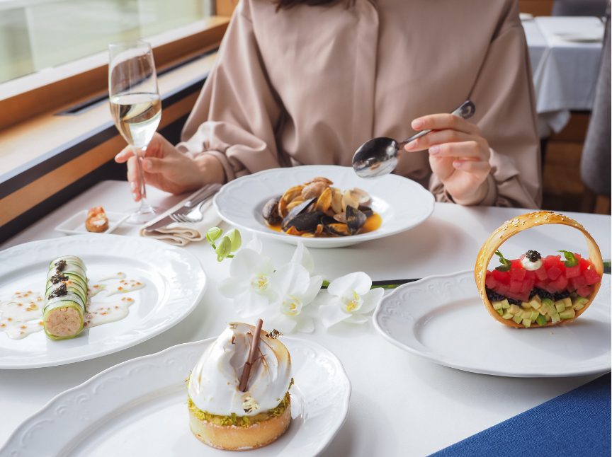 A woman eating an exquisite meal at home.