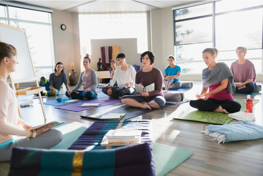 A group of women showing a leadership idea of group journaling and strategizing.