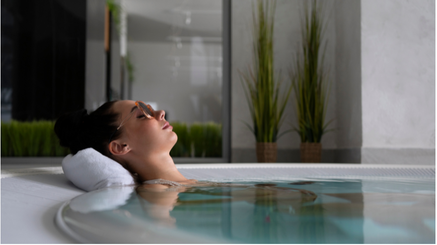 Picture of a women soaking in a tub and contemplating.