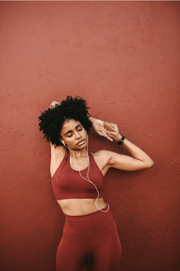 A woman stretching after a workout.