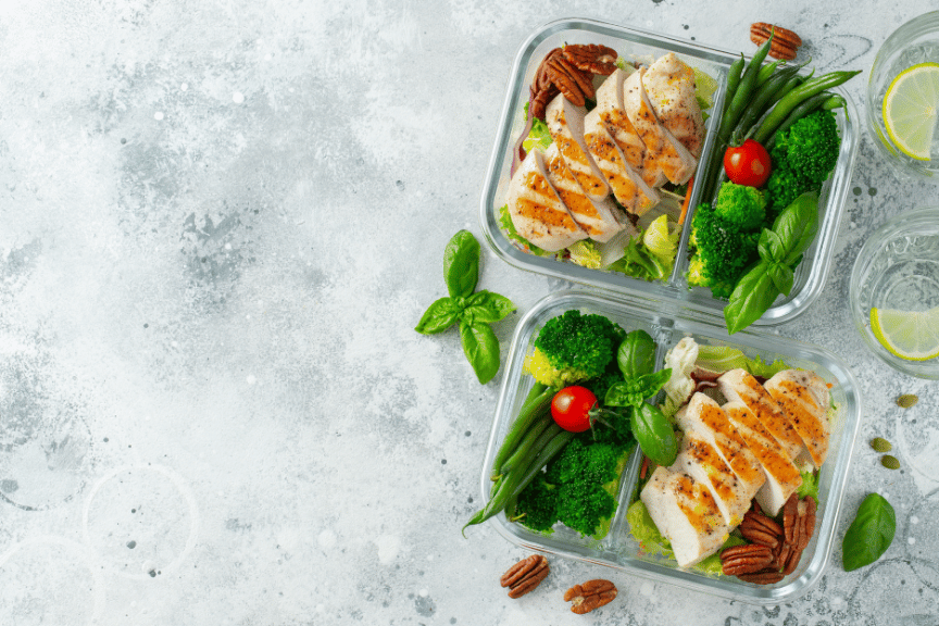 Pre-cooked chicken in portable dish showing how to hit protein goals.