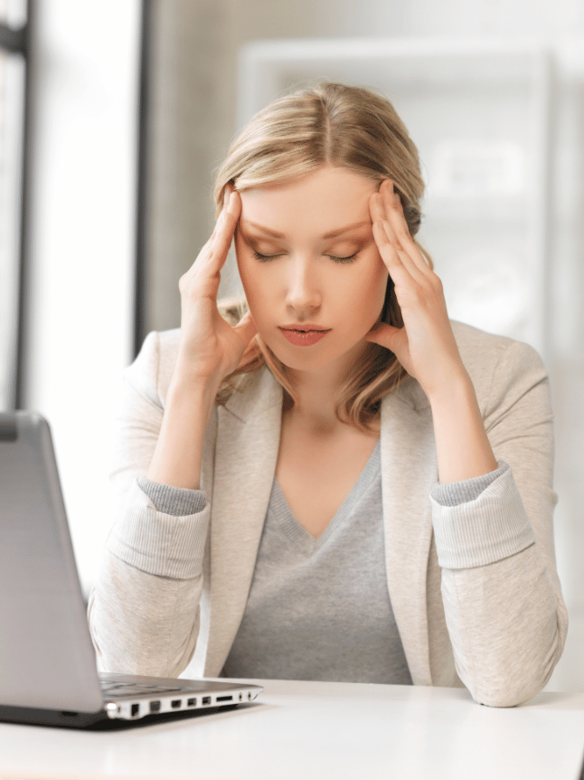 woman at her desk tired of working.