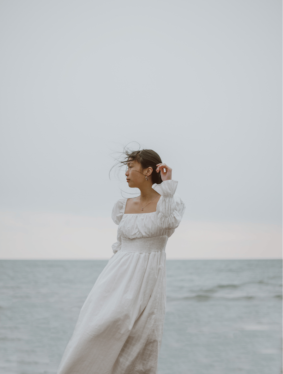 A woman embracing soulful reflections.