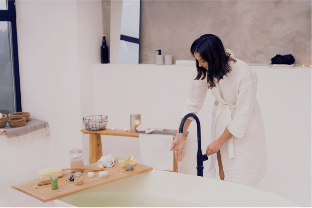 A woman working with her at home spa day checklist.