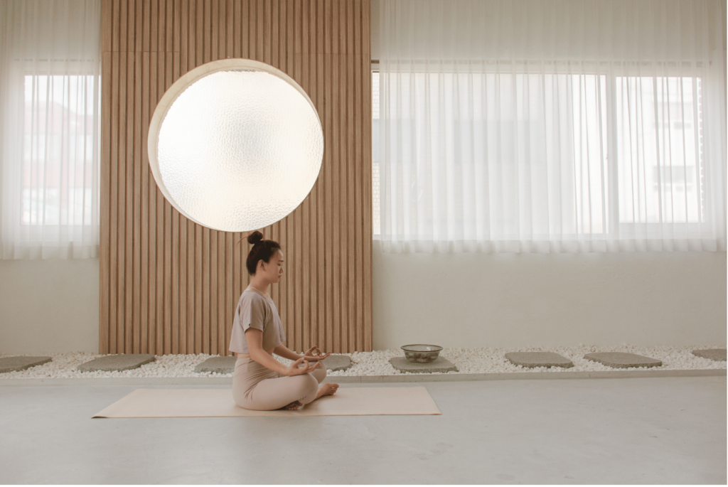 A woman meditating for healthy and holistic living.