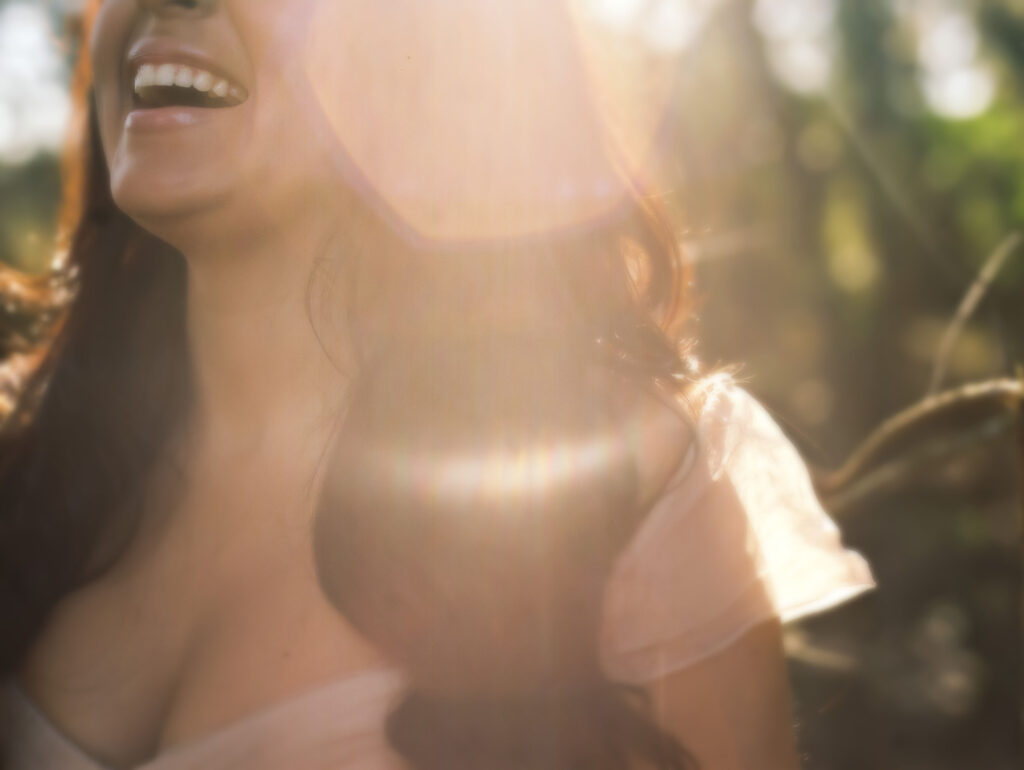 Woman laughing as a self-regulation activity.